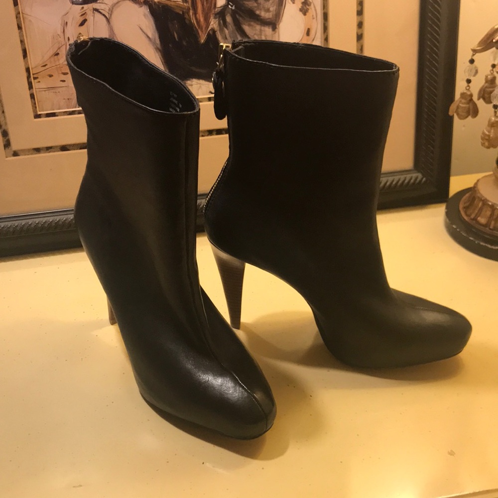 Black heeled Calvin Klein bootie, hidden platform.